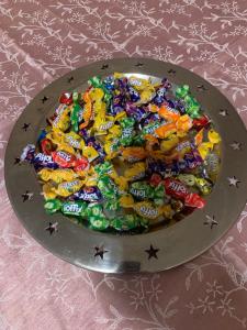 a chocolate cake filled with candy on a silver plate at Toscana 4 Debrecen in Debrecen