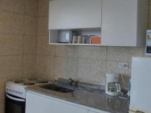 A kitchen or kitchenette at Departamento Ezeiza