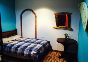 Postel nebo postele na pokoji v ubytování Coral Reef Surf Hostel and Camp
