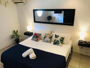 Ένα ή περισσότερα κρεβάτια σε δωμάτιο στο Ocean Lovers Hostel & Apartments
