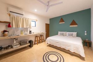 Giường trong phòng chung tại Casa Ikal
