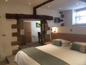 Postel nebo postele na pokoji v ubytování Porthole Suites + 37 fotografií