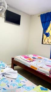 Letto o letti in una camera di Hotel Turista Real