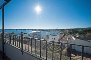 a balcony with a view of the water at Can Alou, Village House With Mediterranean Charme in Felanitx