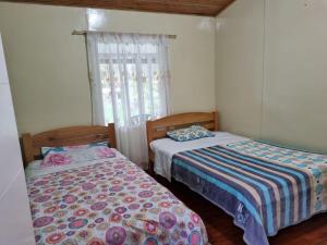 Postel nebo postele na pokoji v ubytování Cabañas 4 Caminos
