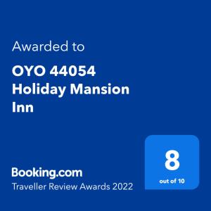 a screenshot of a cell phone with the text awarded to oo holiday at OYO 44054 Holiday Mansion Inn in Sibu