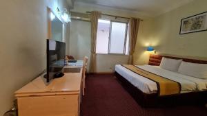 Кровать или кровати в номере Thien Hong - Arc En Ciel Hotel