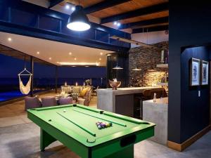 a pool table in a room with a bar at Letlapa Metsi in Denysville