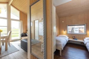 Ein Bett oder Betten in einem Zimmer der Unterkunft Hof Ruhleben Haus Muschelsucher