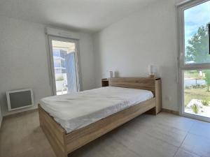 Ліжко або ліжка в номері Appartement spacieux et lumineux dans une résidence à 650m de la mer
