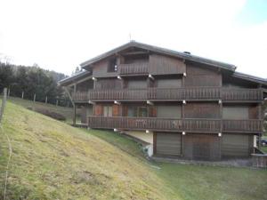 a large wooden house on top of a hill at Les Hauts de Plommaz in Combloux