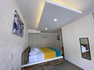 Postel nebo postele na pokoji v ubytování Hotel San Carlos Yautepec
