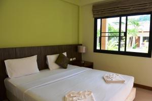 Postel nebo postele na pokoji v ubytování PS 2 Resort Phuket Patong - SHA Plus