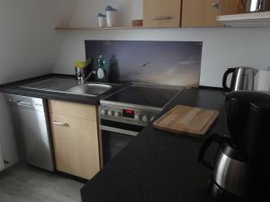 Kuchyň nebo kuchyňský kout v ubytování Ferienwohnung Hansen in Hafennähe