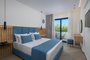 Posteľ alebo postele v izbe v ubytovaní Blue Sea Holiday Village