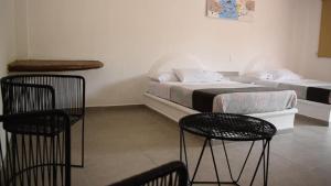 Postel nebo postele na pokoji v ubytování Hotel San Carlos Yautepec