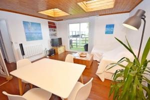 a living room with a white table and chairs at 4 Avocet Quay , Emsworth in Emsworth
