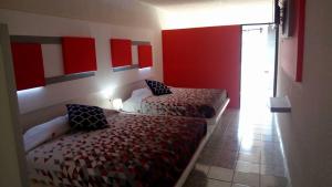 Postel nebo postele na pokoji v ubytování Hotel San Carlos Yautepec