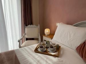 Postel nebo postele na pokoji v ubytování CAVALIERE suite & rooms