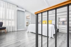 A bed or beds in a room at iloftmalaga Mártires