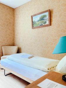 Postel nebo postele na pokoji v ubytování Hotel Gletscherblick