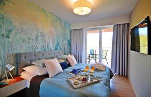 Televízia a/alebo spoločenská miestnosť v ubytovaní SPA Polanki PARK Nemo Apartamenty Kołobrzeg
