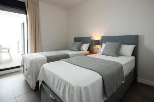Postel nebo postele na pokoji v ubytování Luxury apartment stunning seaview BS 3104