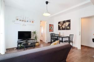 a living room with a couch and a table at NEW Apartamento Tierra Andaluza junto Mezquita in Córdoba