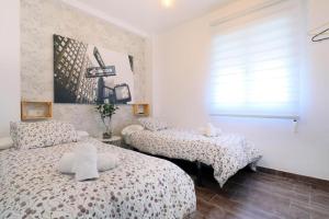 Posteľ alebo postele v izbe v ubytovaní NEW Apartamento Tierra Andaluza junto Mezquita
