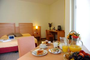 Postel nebo postele na pokoji v ubytování Hotel Foresteria