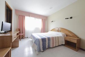 Posteľ alebo postele v izbe v ubytovaní Hotel Paraíso Del Marisco