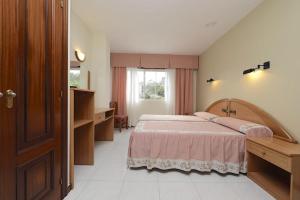 Posteľ alebo postele v izbe v ubytovaní Hotel Paraíso Del Marisco