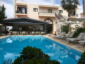 a view of the hotel from the pool at New York Plaza Hotel Apartments in Paphos