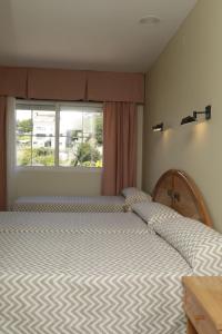 Posteľ alebo postele v izbe v ubytovaní Hotel Paraíso Del Marisco
