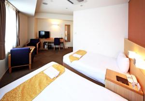 Postel nebo postele na pokoji v ubytování Hotel Sunplaza Osaka Sakai Annex