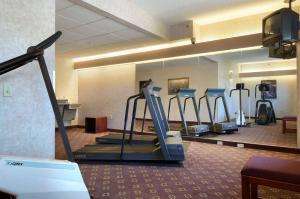 a gym with cardio equipment in a hotel room at Microtel Inn & Suites by Wyndham Bloomington MSP Airport in Bloomington