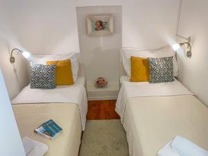 سرير أو أسرّة في غرفة في Casa de Mateo Ellias