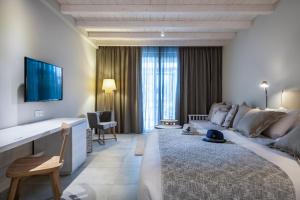 Postel nebo postele na pokoji v ubytování Caravia Beach Hotel