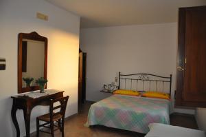 Postel nebo postele na pokoji v ubytování Al Sentiero