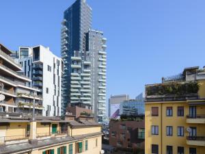 a group of tall buildings in a city at Milanoverse Junior Apartment in Milan +5 photos