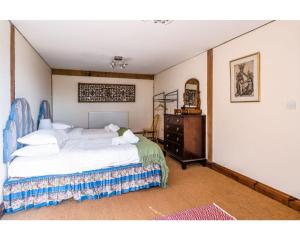מיטה או מיטות בחדר ב-Huish Lodge