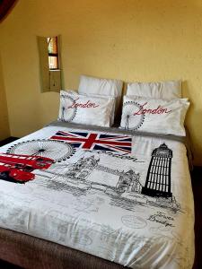 a bed with a drawing of the united kingdom on it at Merry Monte Casino Lodge House in Fourways in Sandton