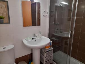 a bathroom with a sink and a shower at Gestiona2R - Apartamento Lita in Posada de Llanes +20 photos