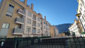 a row of tall buildings in a city at Gestiona2R - Apartamento Lita in Posada de Llanes