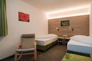 Postel nebo postele na pokoji v ubytování Hotel & Residence Rebhof