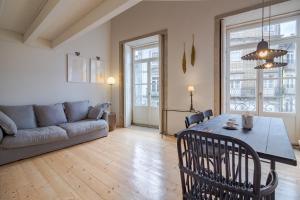 a living room with a table and a couch at YOUROPO - Taipas in Porto