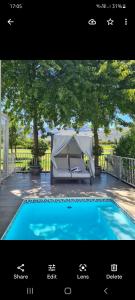 a picture of a tent next to a swimming pool at Boschenmeer House in Paarl