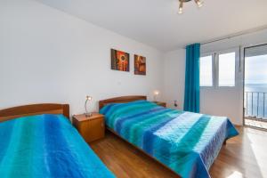 Postel nebo postele na pokoji v ubytování Apartment Mares