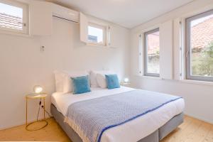 Uma cama ou camas num quarto em YOUROPO - Taipas