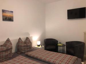 Ein Bett oder Betten in einem Zimmer der Unterkunft Hotel Restaurant Nikopolis